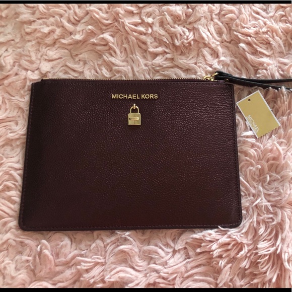 Michael Kors Handbags - Burgundy Michael Kors Adele XL zip clutch